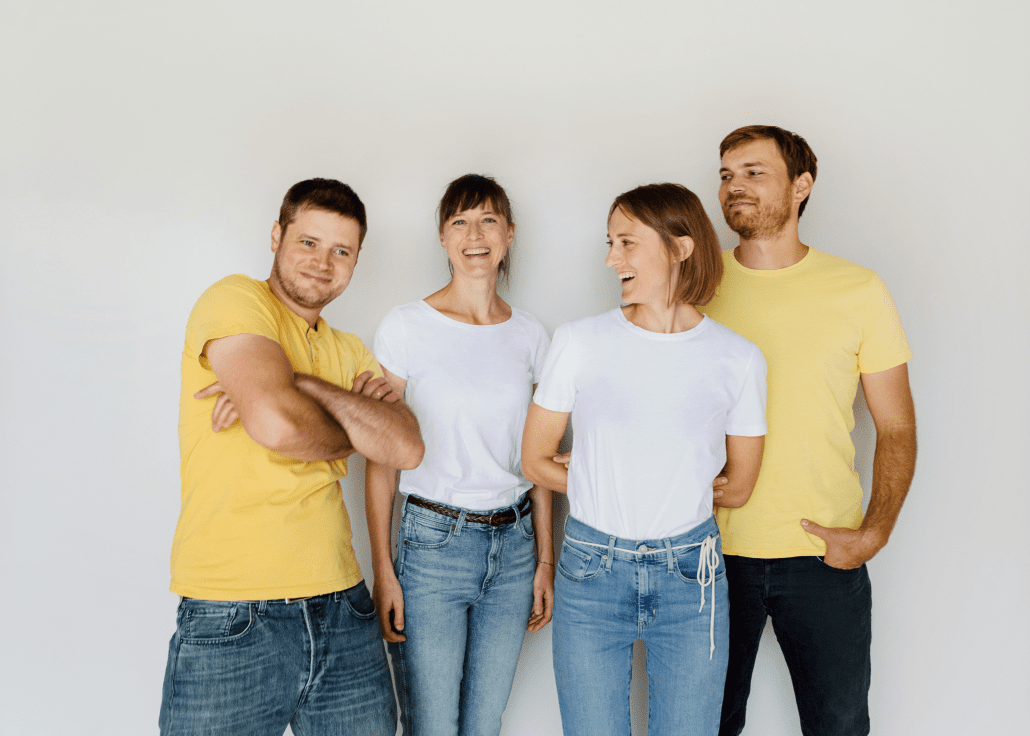 people standing in front of a white wall